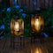 Glitzhome&#xAE; 14.25&#x22; Black Slim Metal Stripes Solar Powered Edison Bulb Outdoor Lantern, 2ct.